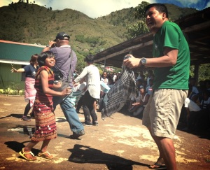 A volunteer dancing the courtship dance with a local.
